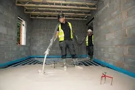 screed being added to concrete ready mix base