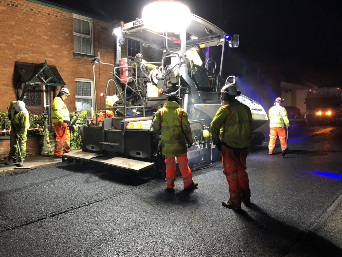 An Aggregate Industries paver laying an asphalt with the Gipave additive as part of a trail with Milestone and Oxfordshire County Council