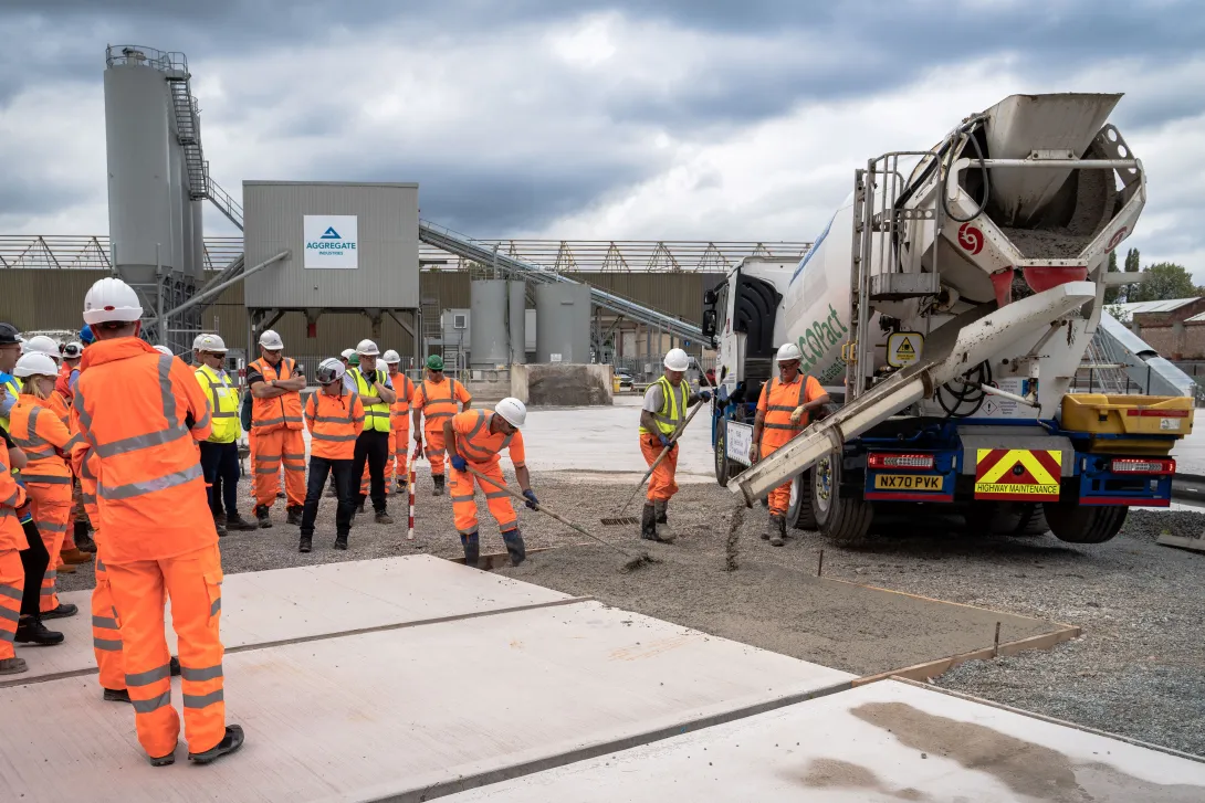 Visitors look on a EcoPact Prime AS mix is poured at SRM Concrete, Manchester