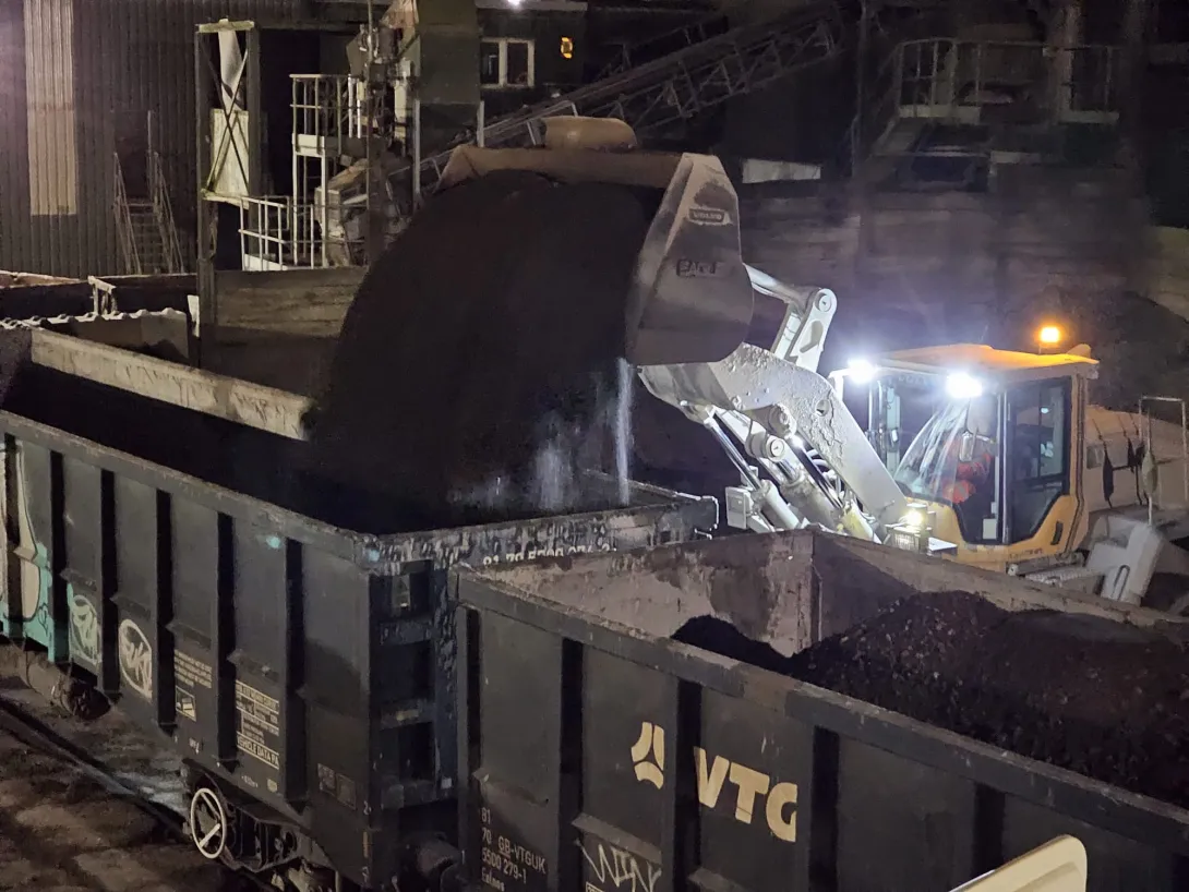 RAP (Reclaimed Asphalt Pavement) being loaded onto rail cars to be transferred to an Aggregate Industries site in London