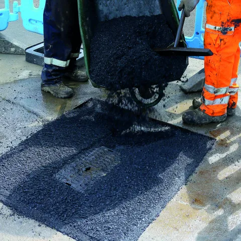 SuperTrench asphalt reinstatement laid round a manhole.jpg