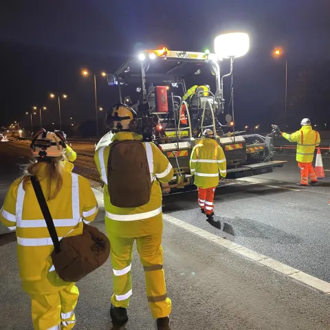 A camera crew from Fearless TV filing for The Motorway look on as Aggregate Industries resurface the M62